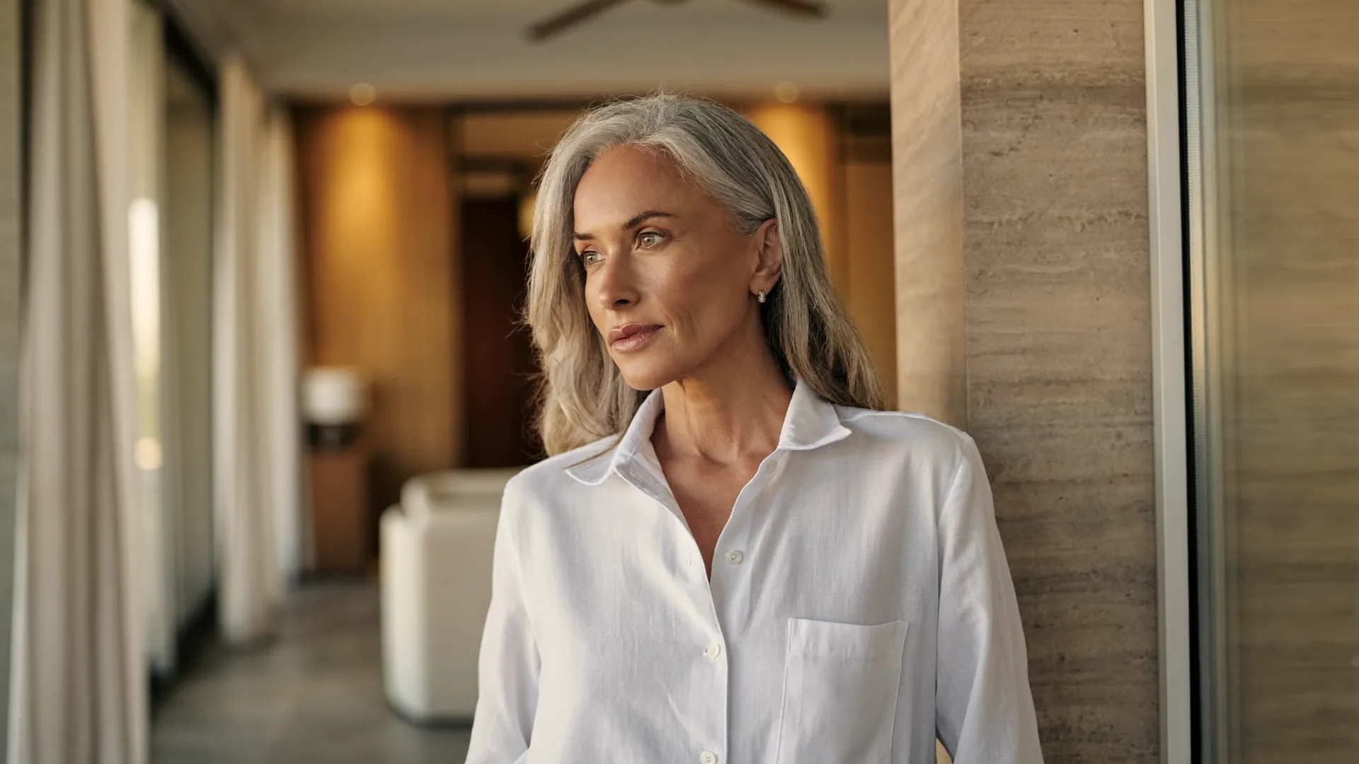 Elegant woman considering the best age for a facelift during a consultation with a Dubai plastic surgeon.