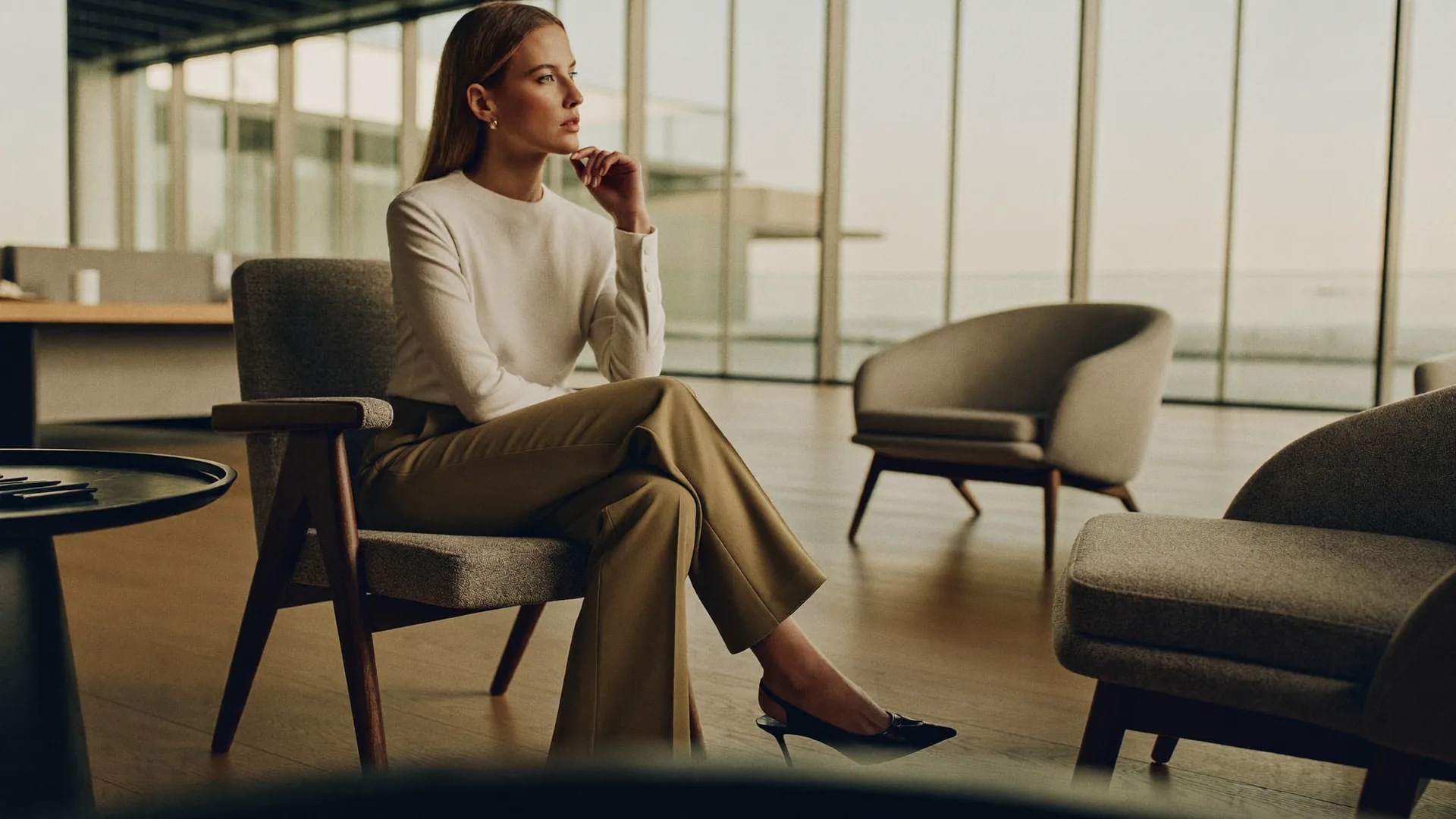 Woman discussing thigh lift surgery options during a consultation in Dubai.